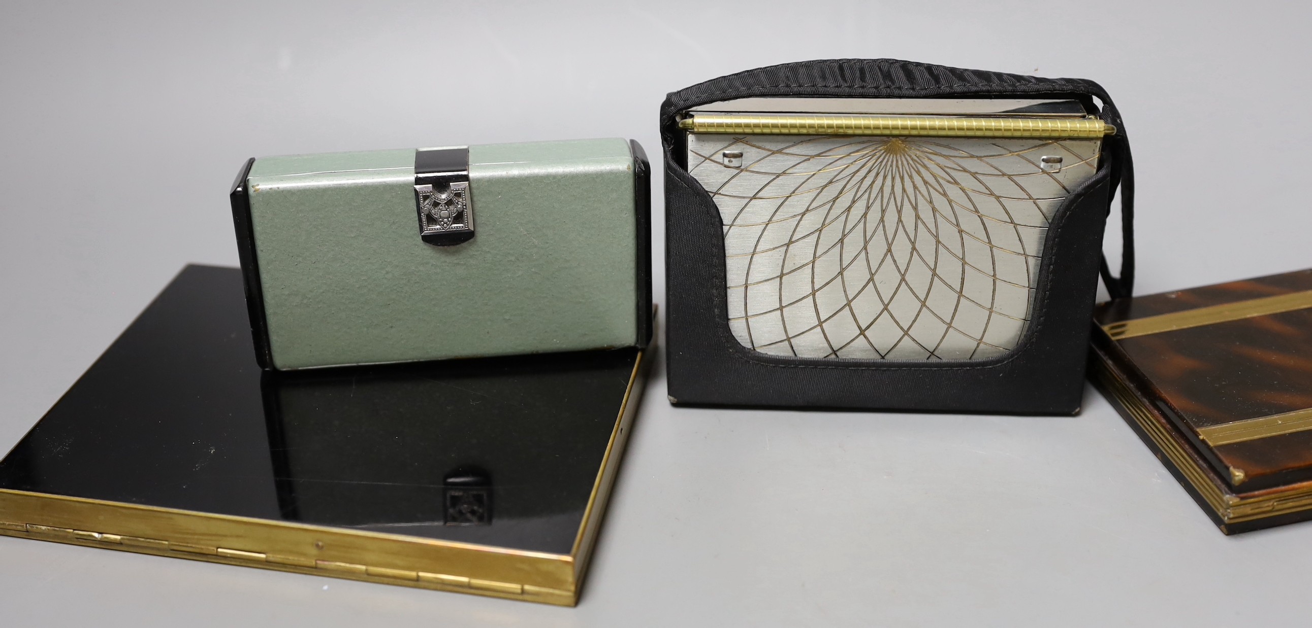 A collection of nine metal 1930’s and later ladies evening minaudière, two with handles, five enamelled, largest 15 cms x 12 cms